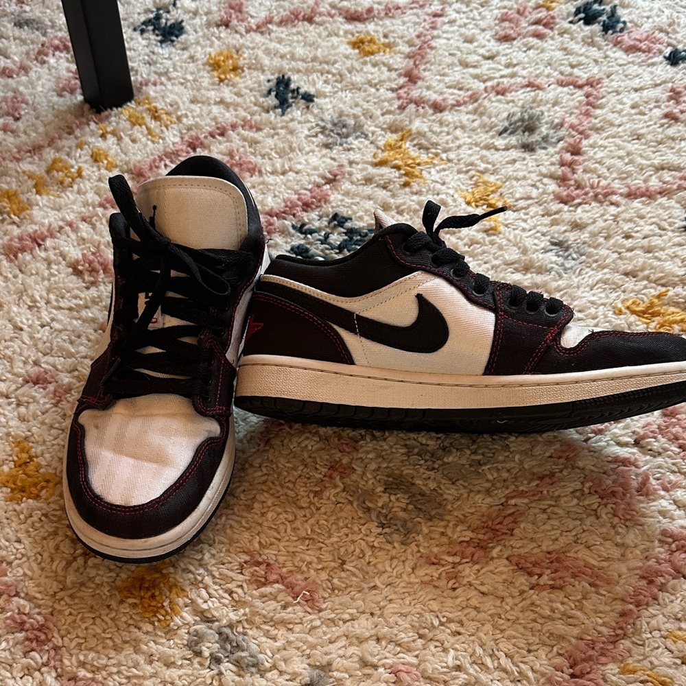 Women’s Air Jordans 1 low black and white with red details . Nylon